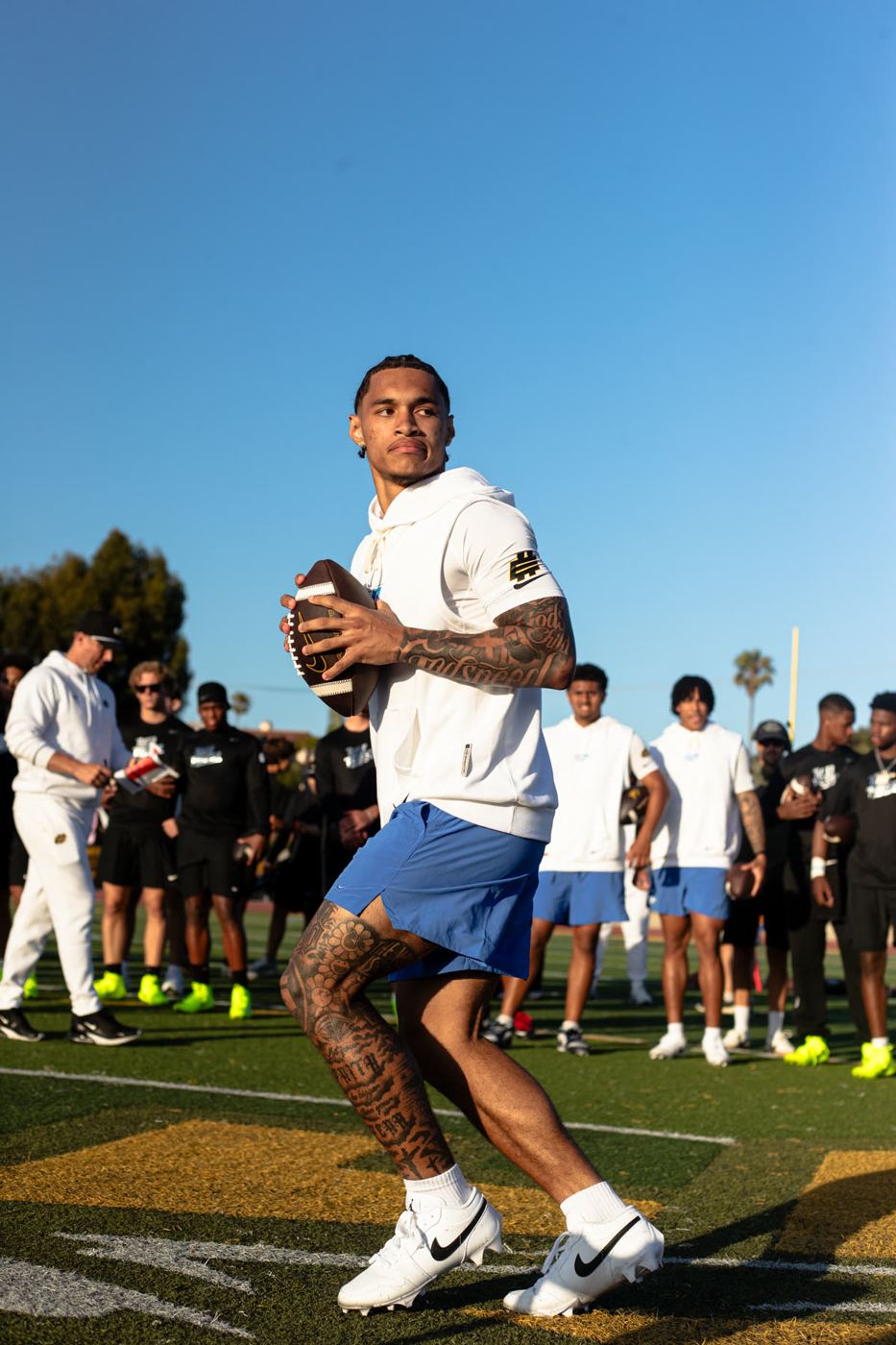 Quarterback throwing at an Elite 11 regional