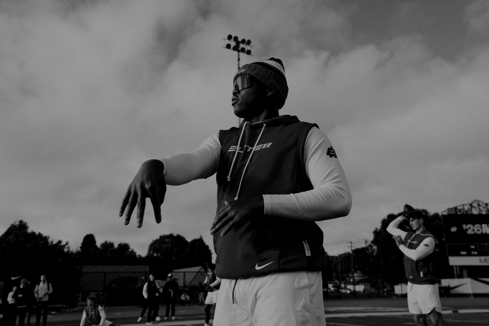 An Elite 11 quarterback follows through on a throw during a Regional event.
